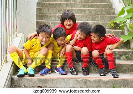 Japanese kids in soccer uniform on a staircase View Large Photo Image Stock Photo - Japanese kids in soccer uniform on a staircase. Fotosearch