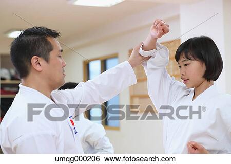 Stock Photograph - Japanese kids karate class. Fotosearch