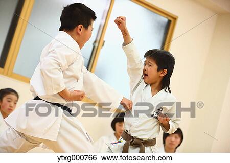 Stock Photograph - Japanese kids karate class. Fotosearch