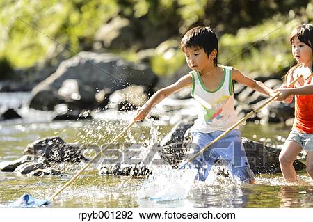 Japanese kids playing at the river View Large Photo Image Stock Image - Japanese kids playing at the river. Fotosearch