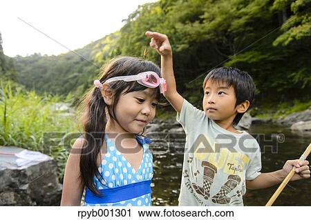 Japanese kids playing at the river View Large Photo Image Stock Image - Japanese kids playing at the river. Fotosearch