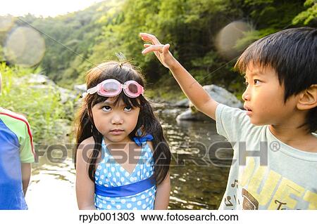Japanese kids playing at the river View Large Photo Image Stock Image - Japanese kids playing at the river. Fotosearch