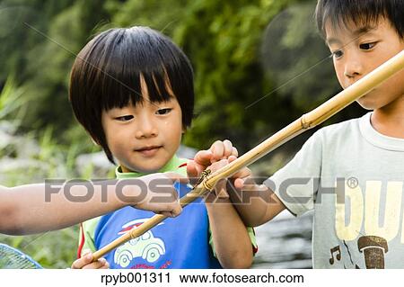 Japanese kids playing at the river View Large Photo Image Stock Image - Japanese kids playing at the river. Fotosearch