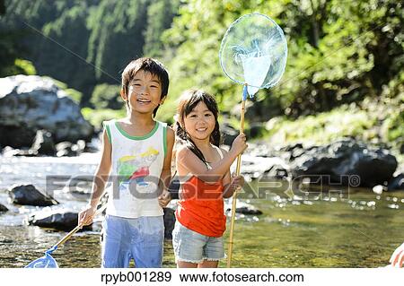 Japanese kids playing at the river View Large Photo Image Stock Photo - Japanese kids playing at the river. Fotosearch