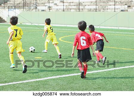 Japanese kids playing soccer View Large Photo Image Picture - Japanese kids playing soccer. Fotosearch