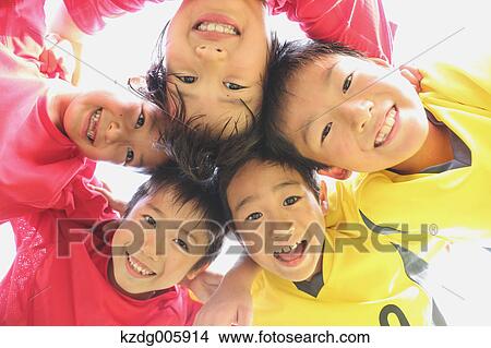 Picture - Japanese kids playing soccer. Fotosearch