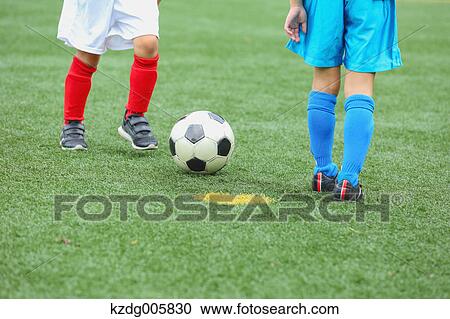 Stock Image - Japanese kids playing soccer. Fotosearch