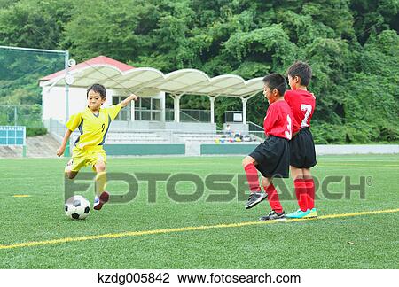 Japanese kids playing soccer View Large Photo Image Stock Image - Japanese kids playing soccer. Fotosearch