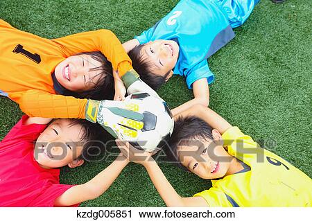 Japanese kids playing soccer View Large Photo Image Stock Image - Japanese kids playing soccer. Fotosearch