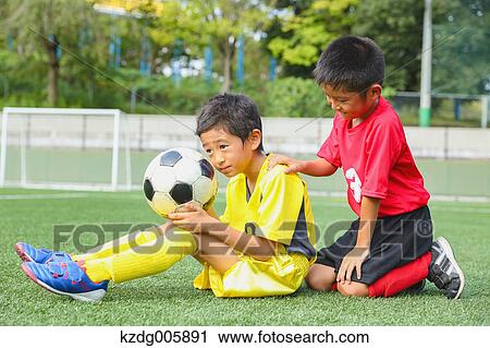 Japanese kids playing soccer View Large Photo Image Stock Image - Japanese kids playing soccer. Fotosearch