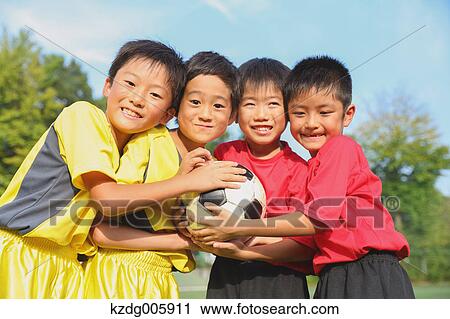 Japanese kids playing soccer View Large Photo Image Stock Image - Japanese kids playing soccer. Fotosearch