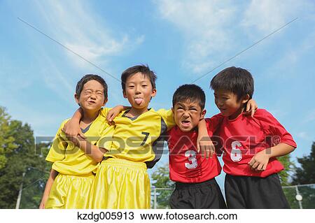 Japanese kids playing soccer View Large Photo Image Stock Image - Japanese kids playing soccer. Fotosearch