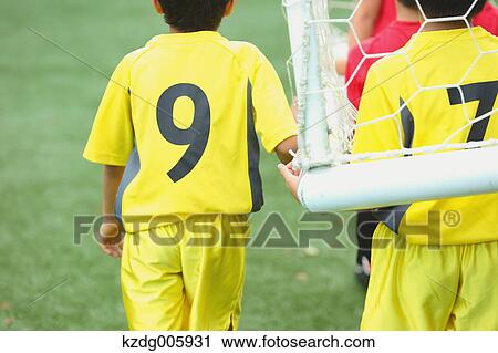 Stock Image - Japanese kids playing soccer. Fotosearch