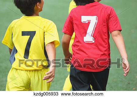 Stock Image - Japanese kids playing soccer. Fotosearch