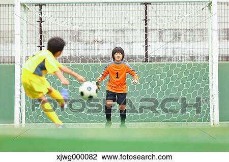 Japanese kids playing soccer View Large Photo Image Stock Image - Japanese kids playing soccer. Fotosearch