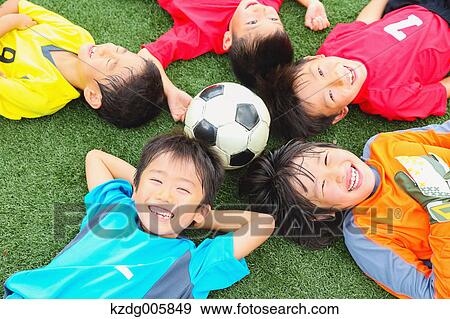 Japanese kids playing soccer View Large Photo Image Stock Photo - Japanese kids playing soccer. Fotosearch
