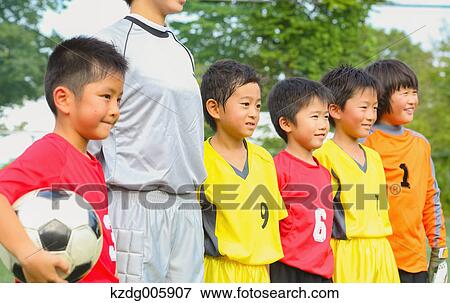 Japanese kids playing soccer View Large Photo Image Stock Photo - Japanese kids playing soccer. Fotosearch