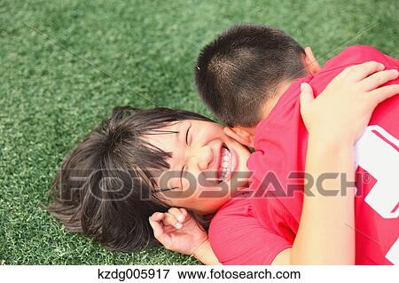 Japanese kids playing soccer View Large Photo Image Stock Photo - Japanese kids playing soccer. Fotosearch