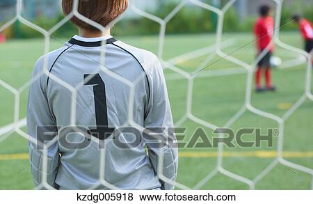 Stock Photo - Japanese kids playing soccer. Fotosearch