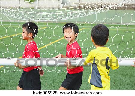 Japanese kids playing soccer View Large Photo Image Stock Photo - Japanese kids playing soccer. Fotosearch