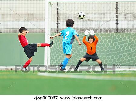 Japanese kids playing soccer View Large Photo Image Stock Photo - Japanese kids playing soccer. Fotosearch