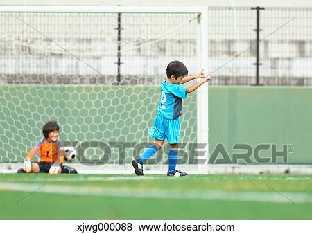 Japanese kids playing soccer View Large Photo Image Stock Photo - Japanese kids playing soccer. Fotosearch