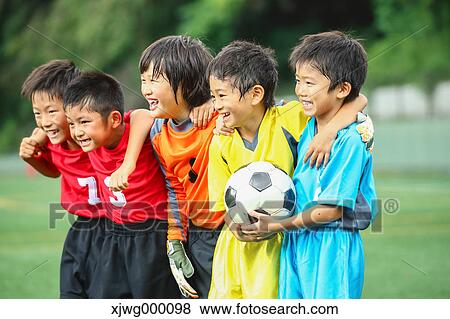 Japanese kids playing soccer View Large Photo Image Stock Photo - Japanese kids playing soccer. Fotosearch