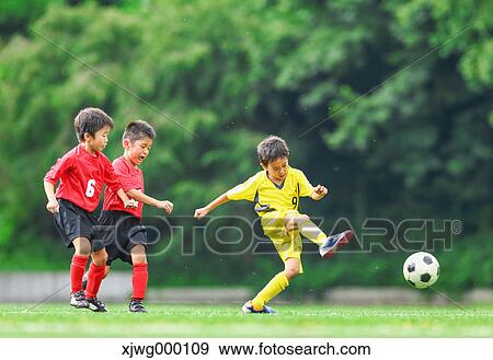 Japanese kids playing soccer View Large Photo Image Stock Photo - Japanese kids playing soccer. Fotosearch