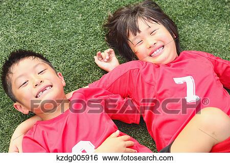 Japanese kids playing soccer View Large Photo Image Stock Photograph - Japanese kids playing soccer. Fotosearch