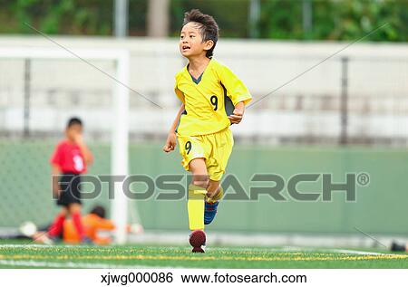 Japanese kids playing soccer View Large Photo Image Stock Photograph - Japanese kids playing soccer. Fotosearch