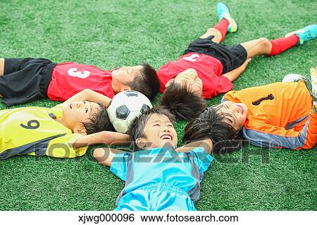 Japanese kids playing soccer View Large Photo Image Stock Photograph - Japanese kids playing soccer. Fotosearch