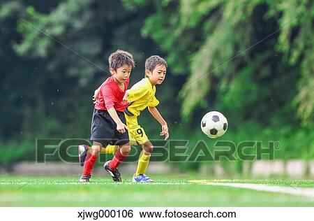 Japanese kids playing soccer View Large Photo Image Stock Photograph - Japanese kids playing soccer. Fotosearch