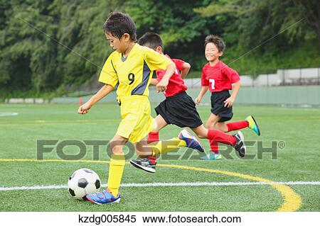 Japanese kids playing soccer View Large Photo Image Stock Photography - Japanese kids playing soccer. Fotosearch