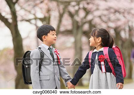 Japanese kids with cherry blossoms in a city park View Large Photo Image Stock Image - Japanese kids with cherry blossoms in a city park. Fotosearch