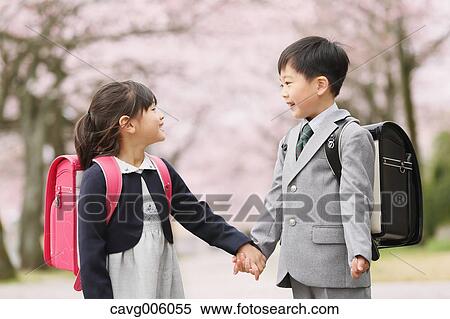 Japanese kids with cherry blossoms in a city park View Large Photo Image Stock Photography - Japanese kids with cherry blossoms in a city park. Fotosearch