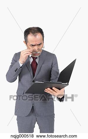 Stock Photo - Japanese senior businessman on white background. Fotosearch