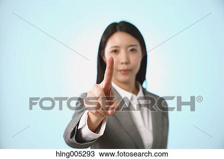 Japanese woman performing touch gesture View Large Photo Image Stock Image - Japanese woman performing touch gesture. Fotosearch