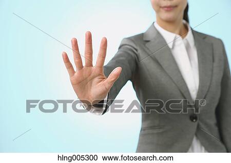 Japanese woman performing touch gesture View Large Photo Image Stock Image - Japanese woman performing touch gesture. Fotosearch