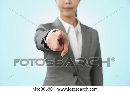 Stock Image - Japanese woman performing touch gesture. Fotosearch