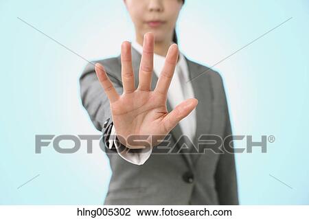 Japanese woman performing touch gesture View Large Photo Image Stock Image - Japanese woman performing touch gesture. Fotosearch