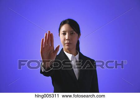 Japanese woman performing touch gesture View Large Photo Image Stock Image - Japanese woman performing touch gesture. Fotosearch