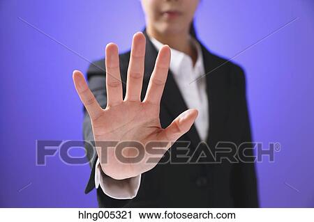 Stock Image - Japanese woman performing touch gesture. Fotosearch