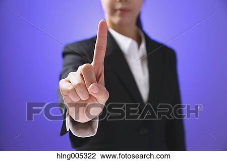 Japanese woman performing touch gesture View Large Photo Image Stock Image - Japanese woman performing touch gesture. Fotosearch