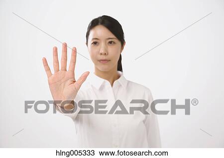 Japanese woman performing touch gesture View Large Photo Image Stock Image - Japanese woman performing touch gesture. Fotosearch