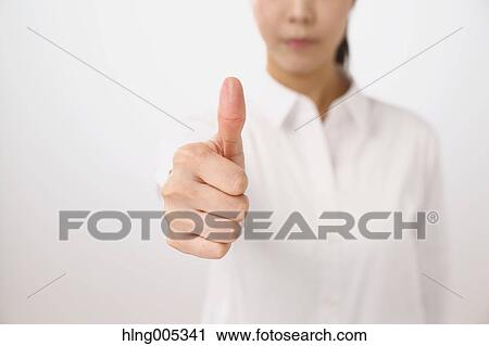 Japanese woman performing touch gesture View Large Photo Image Stock Image - Japanese woman performing touch gesture. Fotosearch