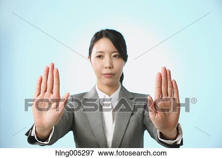 Japanese woman performing touch gesture View Large Photo Image Stock Photo - Japanese woman performing touch gesture. Fotosearch