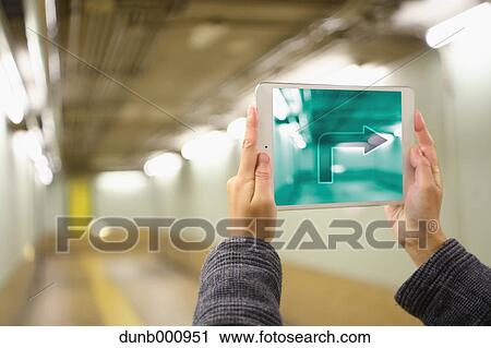 Japanese woman using augumented reality app on tablet downtown Tokyo, Japan View Large Photo Image Stock Image - Japanese woman using augumented reality app on tablet downtown Tokyo, Japan. Fotosearch