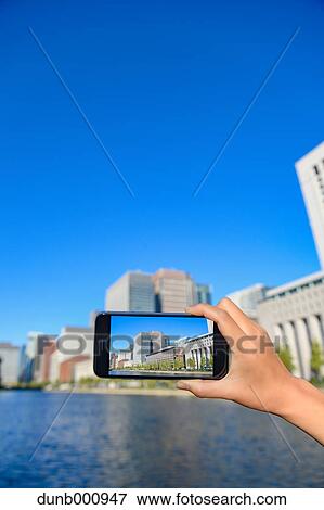 Japanese woman using augumented reality app on smartphone downtown Tokyo, Japan View Large Photo Image Stock Photo - Japanese woman using augumented reality app on smartphone downtown Tokyo, Japan. Fotosearch