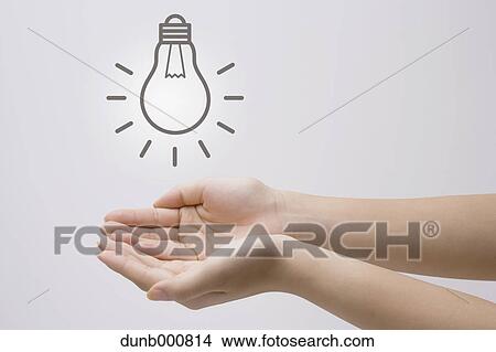 Japanese woman with light bulb View Large Photo Image Picture - Japanese woman with light bulb. Fotosearch