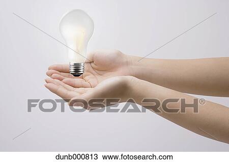 Japanese woman with light bulb View Large Photo Image Stock Image - Japanese woman with light bulb. Fotosearch